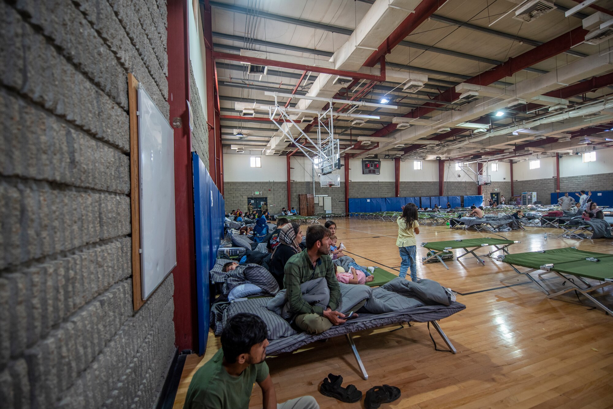Qualified evacuees rest at a gym in the CENTCOM region, Aug. 20, 2021.