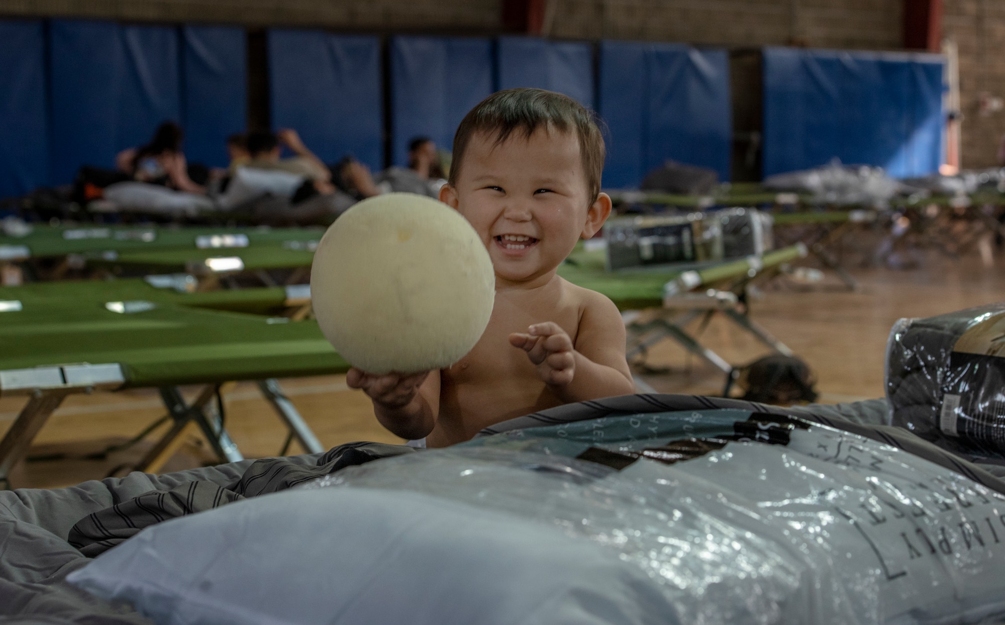 A child plays with a ball at a gym in the CENTCOM region, Aug. 20, 2021.