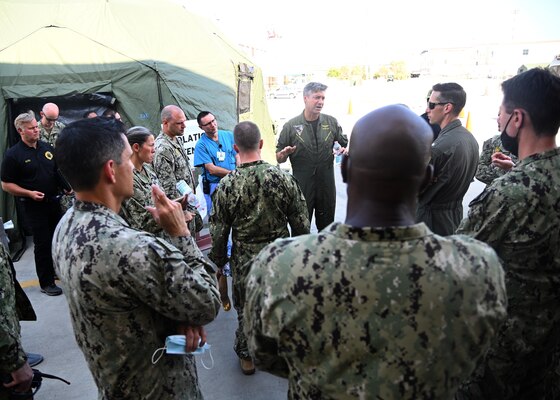 Capt. Kepper Pickard, commanding officer Naval Air Station Sigonella, briefs his staff on the Department of Defense mission to facilitate the safe departure and relocation of U.S. citizens, Special Immigration Visa recipients, and vulnerable Afghan populations from Afghanistan, Aug. 20, 2021.