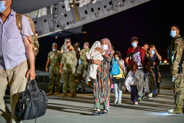 Afghan evacuees disembark a U.S. Air Force C-17 Globemaster III at Naval Air Station Sigonella, Aug. 22, 2021.