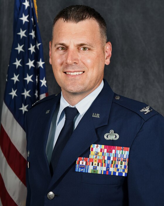 Colonel wearing blue uniform.