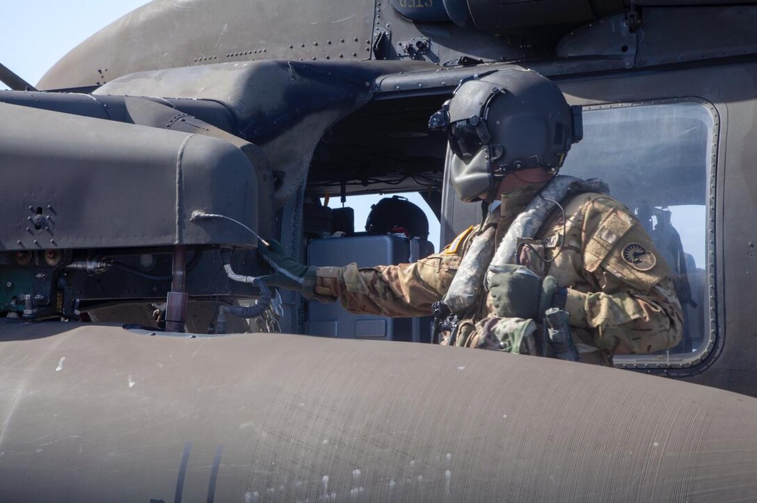 Aircrew with the 1st Battalion, 228th Aviation Regiment, Joint Task Force-Bravo, Soto Cano Air Base, Honduras, conduct deck-landing qualifications aboard the Royal Navy’s Royal Fleet Auxiliary Wave Knight in the Caribbean, Aug. 18, 2021.