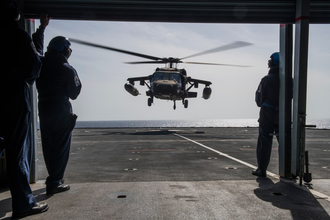 Aircrew with the 1st Battalion, 228th Aviation Regiment, Joint Task Force-Bravo, Soto Cano Air Base, Honduras, conduct deck-landing qualifications aboard the Royal Navy’s Royal Fleet Auxiliary Wave Knight in the Caribbean, Aug. 18, 2021.