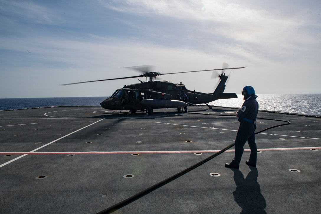 Aircrew with the 1st Battalion, 228th Aviation Regiment, Joint Task Force-Bravo, Soto Cano Air Base, Honduras, conduct deck-landing qualifications aboard the Royal Navy’s Royal Fleet Auxiliary Wave Knight in the Caribbean, Aug. 18, 2021.
