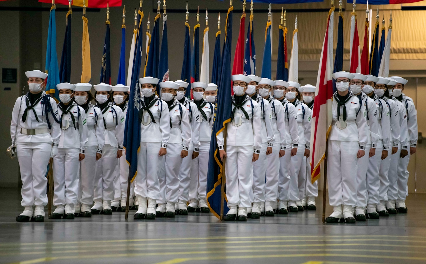 Sailors graduate from Recruit Training Command in front of guests.