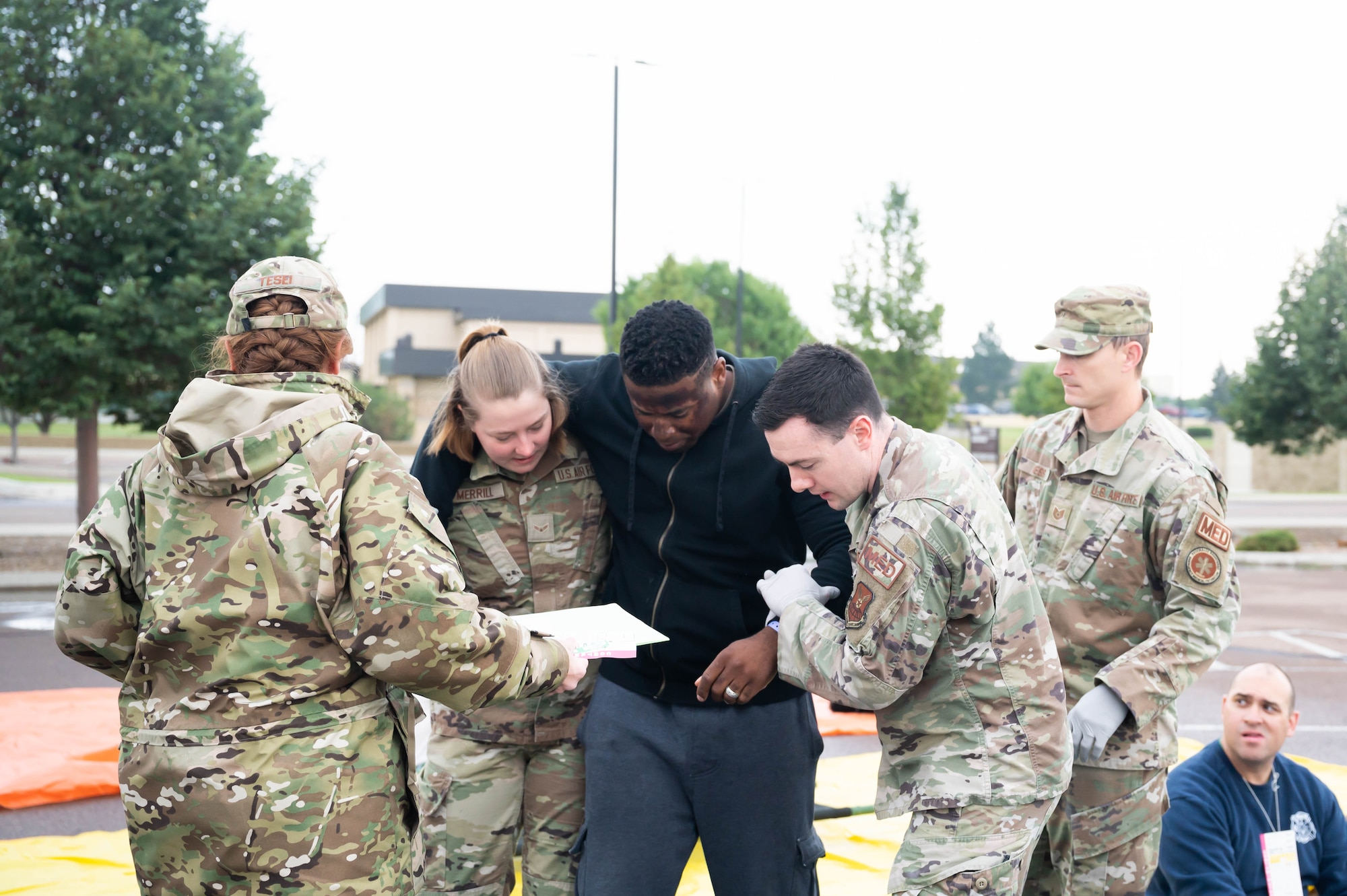 Members of the 341st Medical Group help move a simulated patient to the correct waiting area during a medical readiness exercise Aug. 20, 2021, at Malmstrom Air Force Base, Mont.