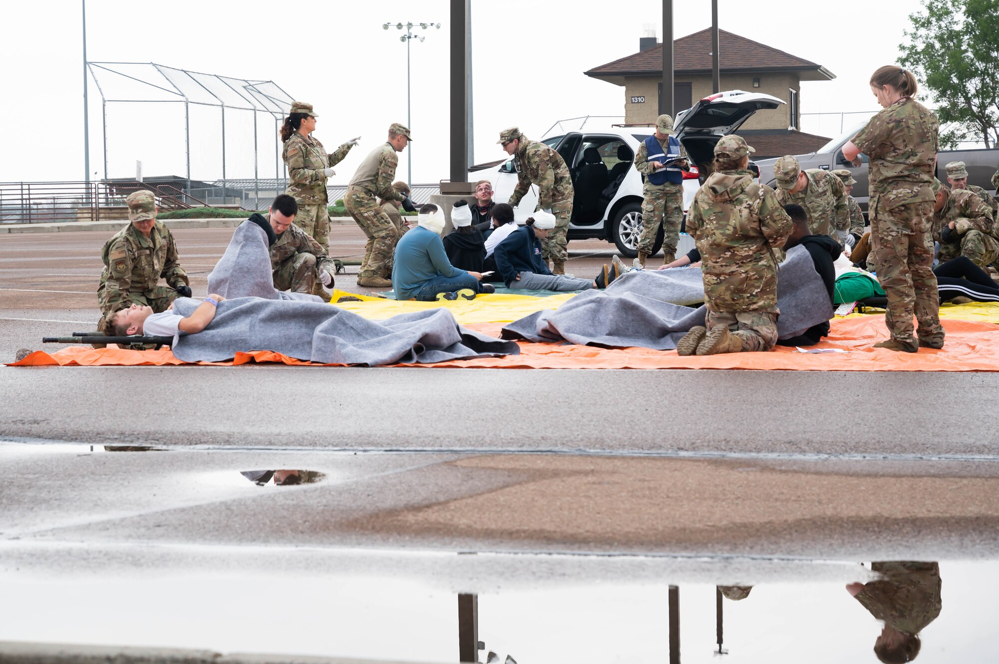 Members of the 341st Medical Group assess and provide initial treatment for patients simulated by volunteers during a medical readiness exercise Aug. 20, 2021 at Malmstrom Air Force Base, Mont.