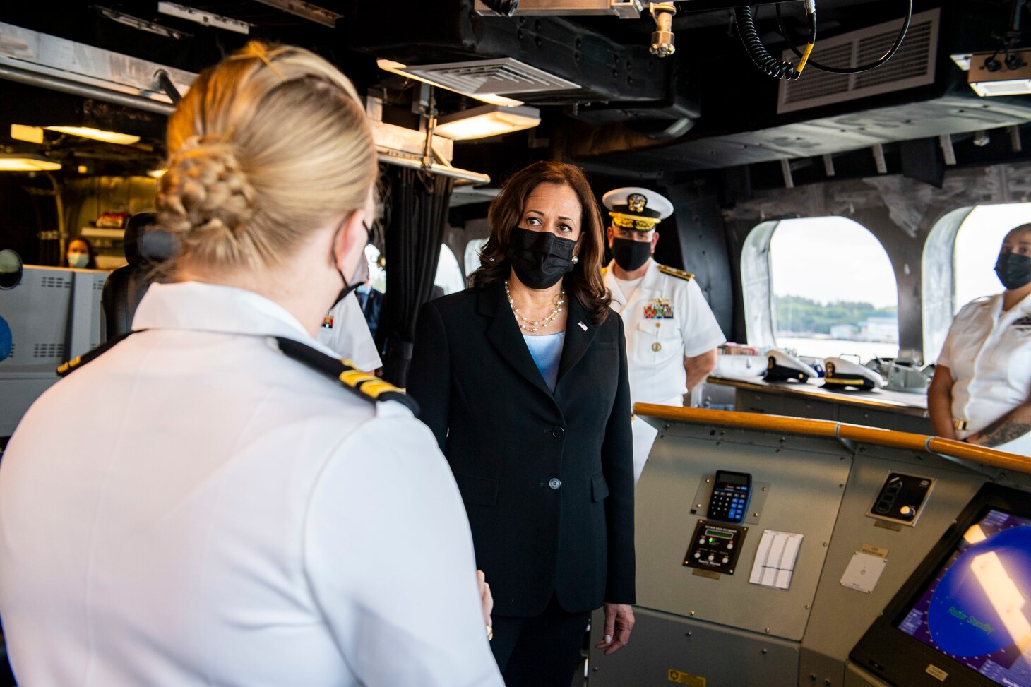 Vice President Kamala Harris discusses navigation with Lt. Katie Canant during a visit aboard the Independence-variant littoral combat ship USS Tulsa (LCS 16), Aug. 23, 2021.