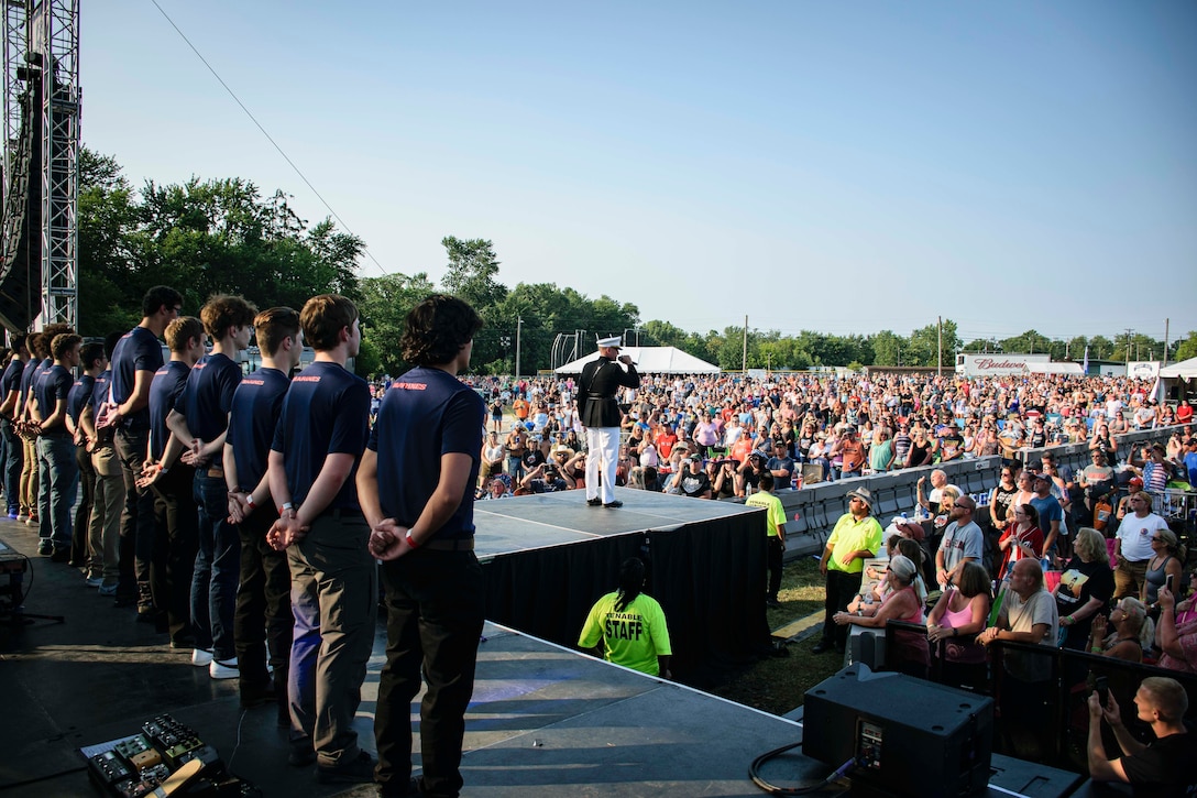 U.S. Marine Capt. Justin Hebert, the operations officer at Recruiting Station (RS) Cleveland gives his closing remarks after a swear in ceremony at the Cuyahoga County Fairgrounds during WGAR’s 99.5 Country Jam in Middleburg Heights, Ohio, Aug. 21, 2021. The event allowed recruiters to engage with the local community and to invite civilians to participate in a pull-up challenge to earn Marine Corps prizes. During the concert RS Cleveland held a swear in ceremony in order to raise awareness about the Marine Corps. (U.S. Marine Corps photo by Cpl. Nello Miele)