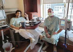 Dan Florida (left) and his brother Master Sgt. Chris Florida, the first sergeant with the 339th Recruiting Squadron, Clinton Township, Michigan, sit together the day after Chris donated his kidney to his older brother.