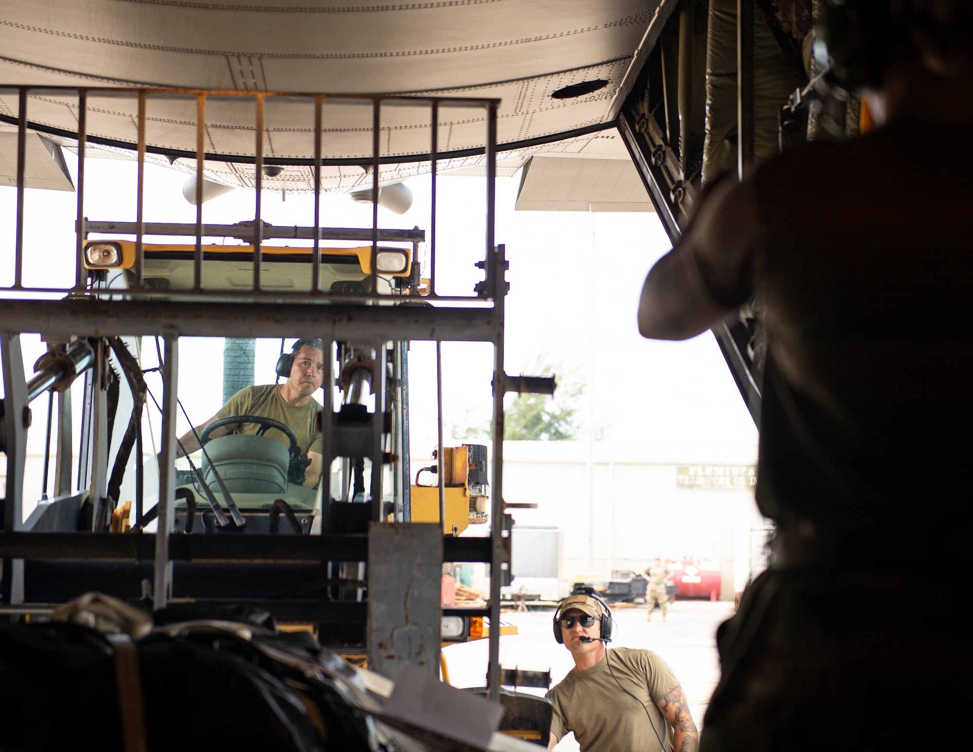 U.S. Air Force Tech. Sgt. Avcadio Acevedo, 146th Contingency Response Flight, California Air National Guard, loads a pallet onto a C-130 Hercules from the Minnesota Air National Guard in St. Croix, Virgin Islands, Aug. 17, 2021.