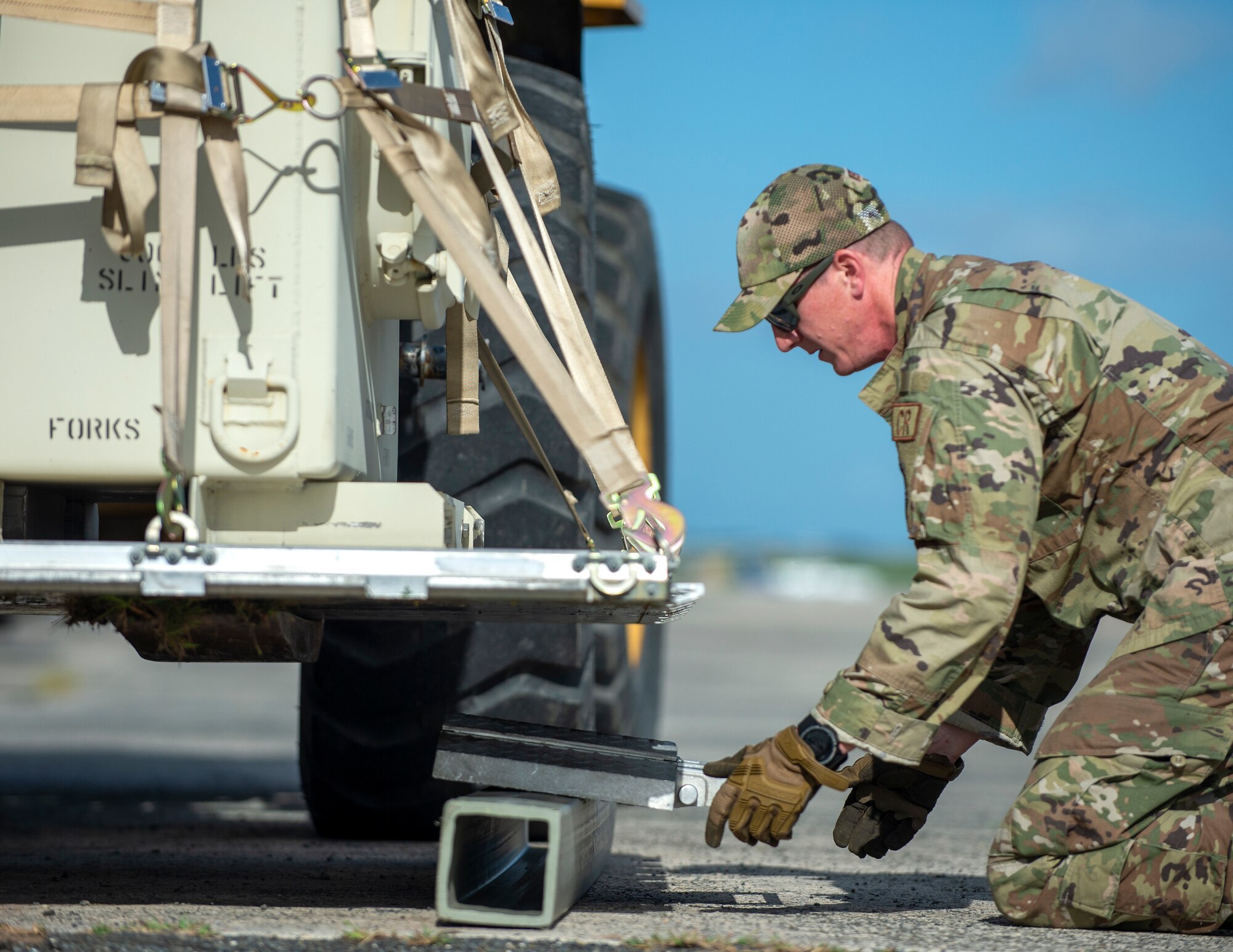 U.S. Air Force Tech. Sgt. Ross Wehrle, 133rd Contingency Response Flight, Minnesota Air National Guard, prepares to weigh a pallet in St. Croix, Virgin Islands, Aug. 18, 2021.
