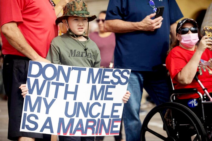 Friends and family of the new Marines of Bravo Company, 1st Recruit Training Battalion wait for their Marines to arrive for the motivational run at Marine Corps Recruit Training Depot, San Diego, Aug. 19, 2021.