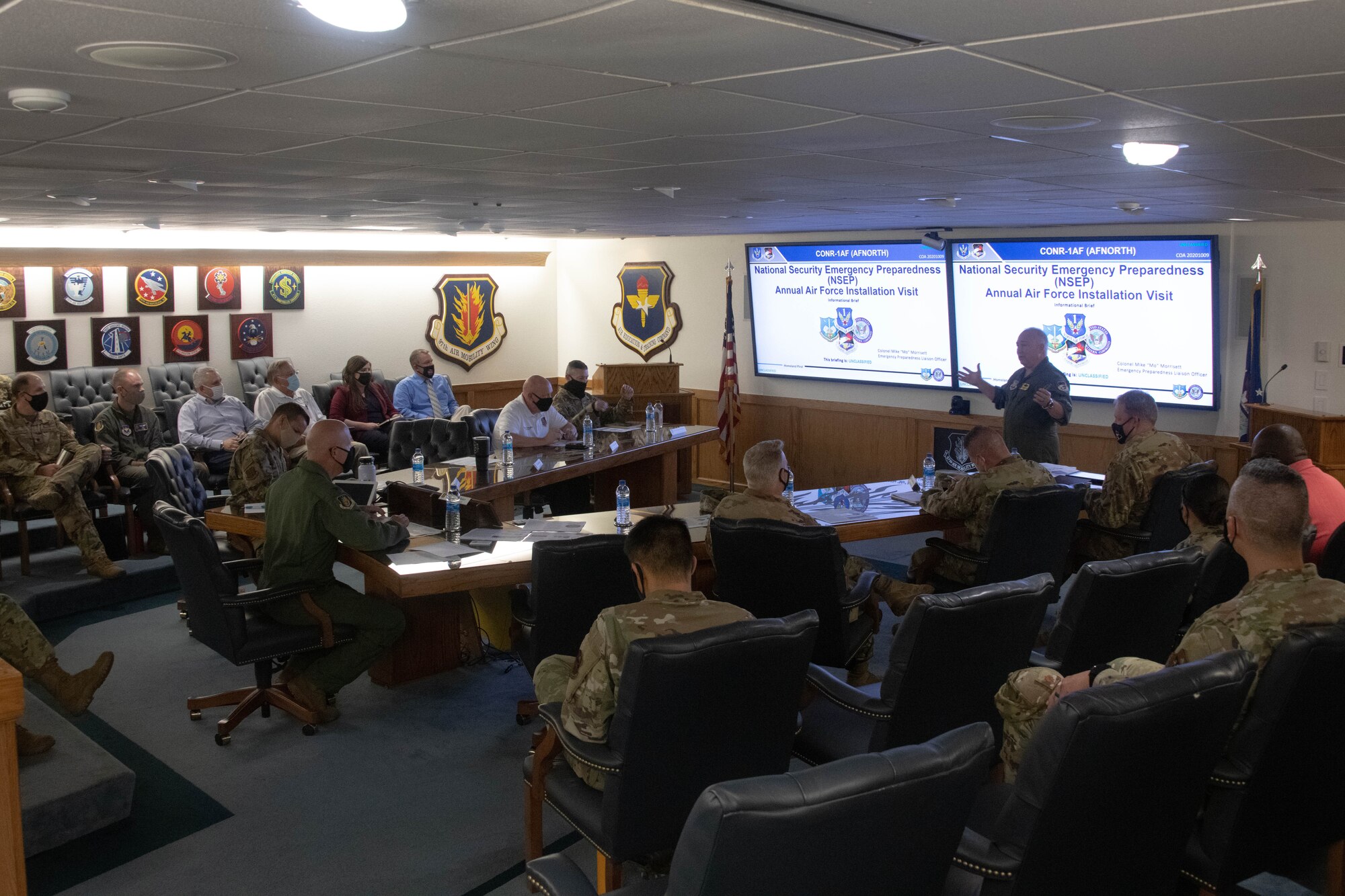 U.S. Air Force Col. Michael Morrisett, Emergency Preparedness Liaison Officer (EPLO) to Oklahoma, briefs senior leaders from the 97th Air Mobility Wing on Altus Air Force Base, Oklahoma, Aug. 19, 2021. As the EPLO, Morrisett is the liaison between the Department of Defense and any federal, state, or local agencies during a disaster. (U.S. Air Force photo by Airman 1st Class Trenton Jancze)