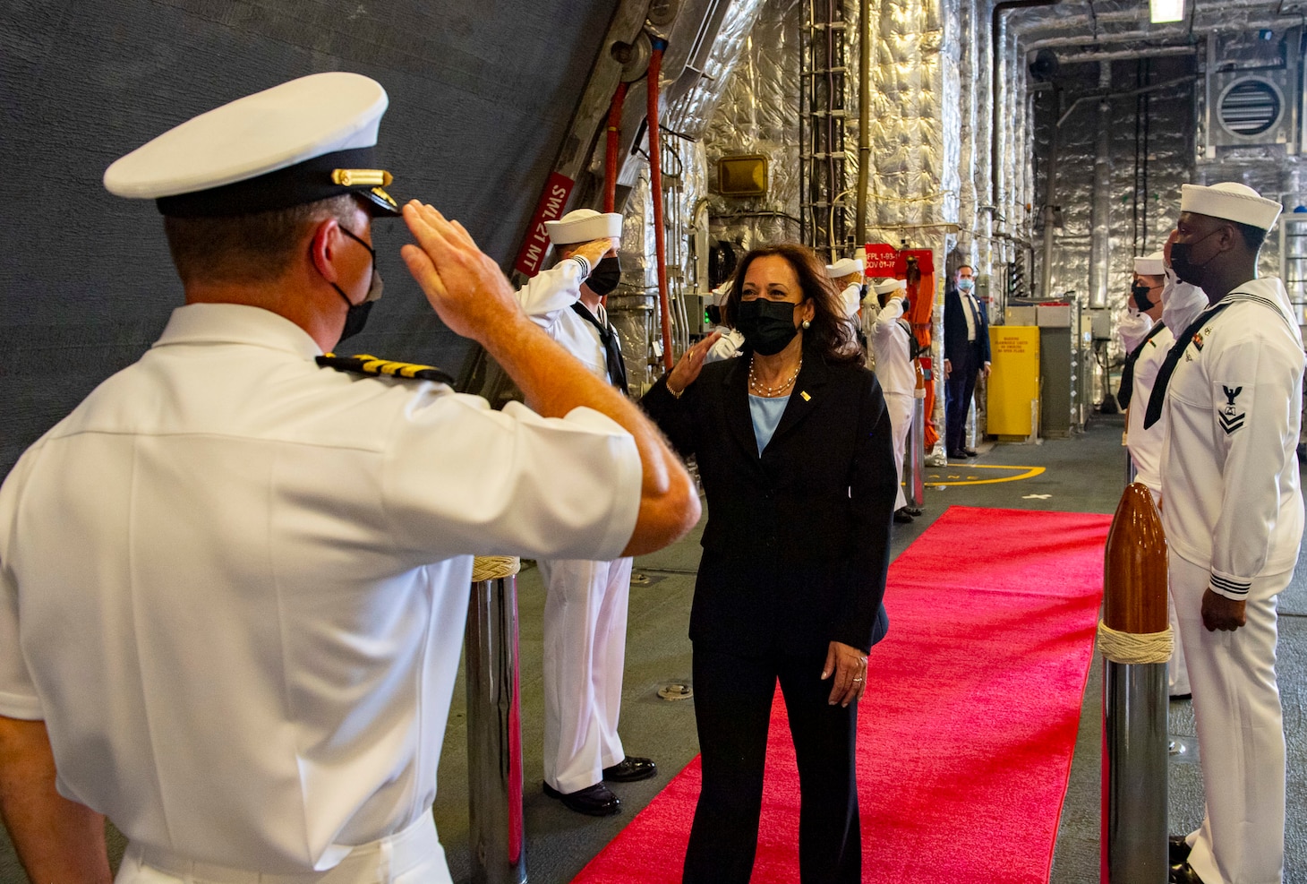 SINGAPORE (AUG. 23, 2021) Vice President Kamala Harris is greeted by Cmdr. Brandon Cornes, the commanding officer of the Independence-variant littoral combat ship USS Tulsa (LCS 16), Aug. 23, 2021. Tulsa, part of Destroyer Squadron Seven, is on a rotational deployment in the U.S. 7th Fleet area of operation to enhance interoperability with partners and serve as a ready-response force in support of a free and open Indo-Pacific region.