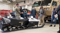 Alaska Army National Guard 1st Lt. Jacob Olson, a shop lead at the Guard's Combined Support Maintenance Shop gives a tour of the facility to local Anchorage business representatives to bolster the Army Guard's new Partnership for Youth Success Program, Aug. 20, 2021. (U.S. Army National Guard photo by Sgt. Seth LaCount)