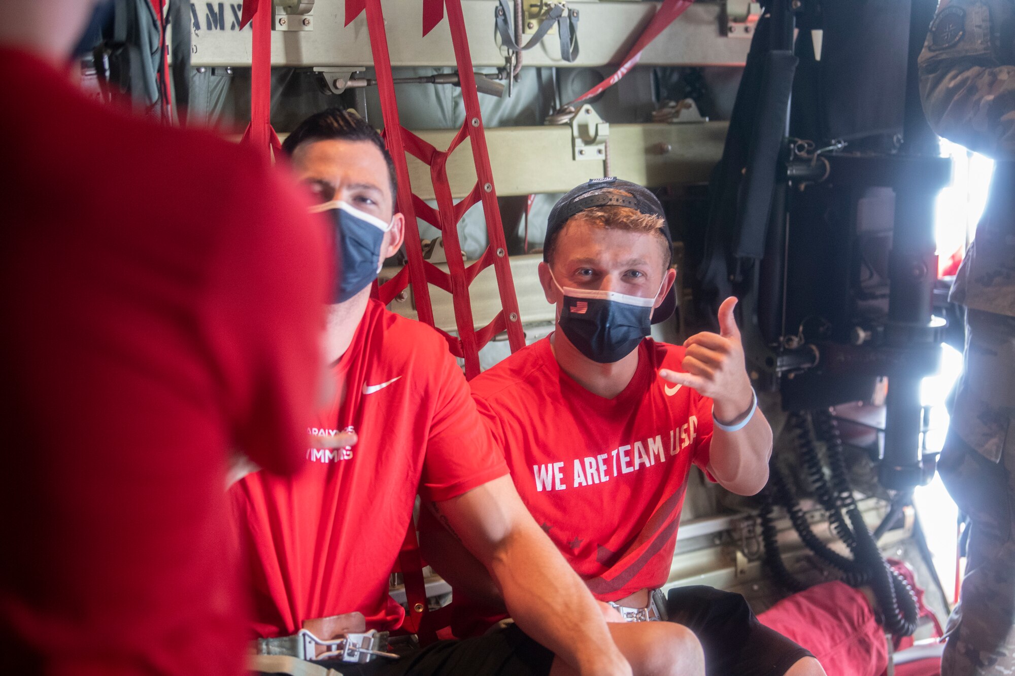U.S. Paralympians pose inside a C-130J Super Hercules at Yokota Air Base, Japan, Aug. 18, 2021, before competing in the 2020 Summer Paralympic games in Tokyo.