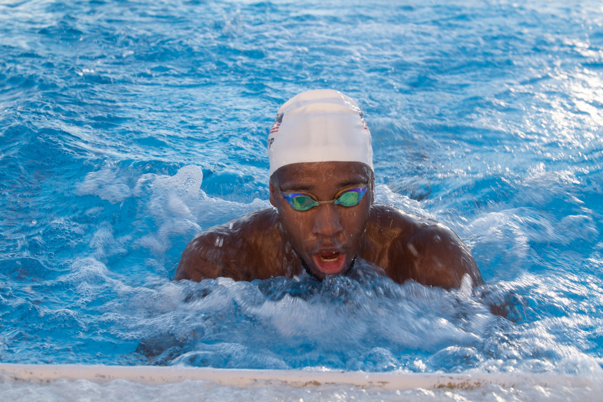 Lawrence Sapp, U.S. Paralympic swimmer, finishes a practice lap at Yokota Air Base, Japan, Aug. 18, 2021, before competing in the 2020 Summer Paralympic games in Tokyo.