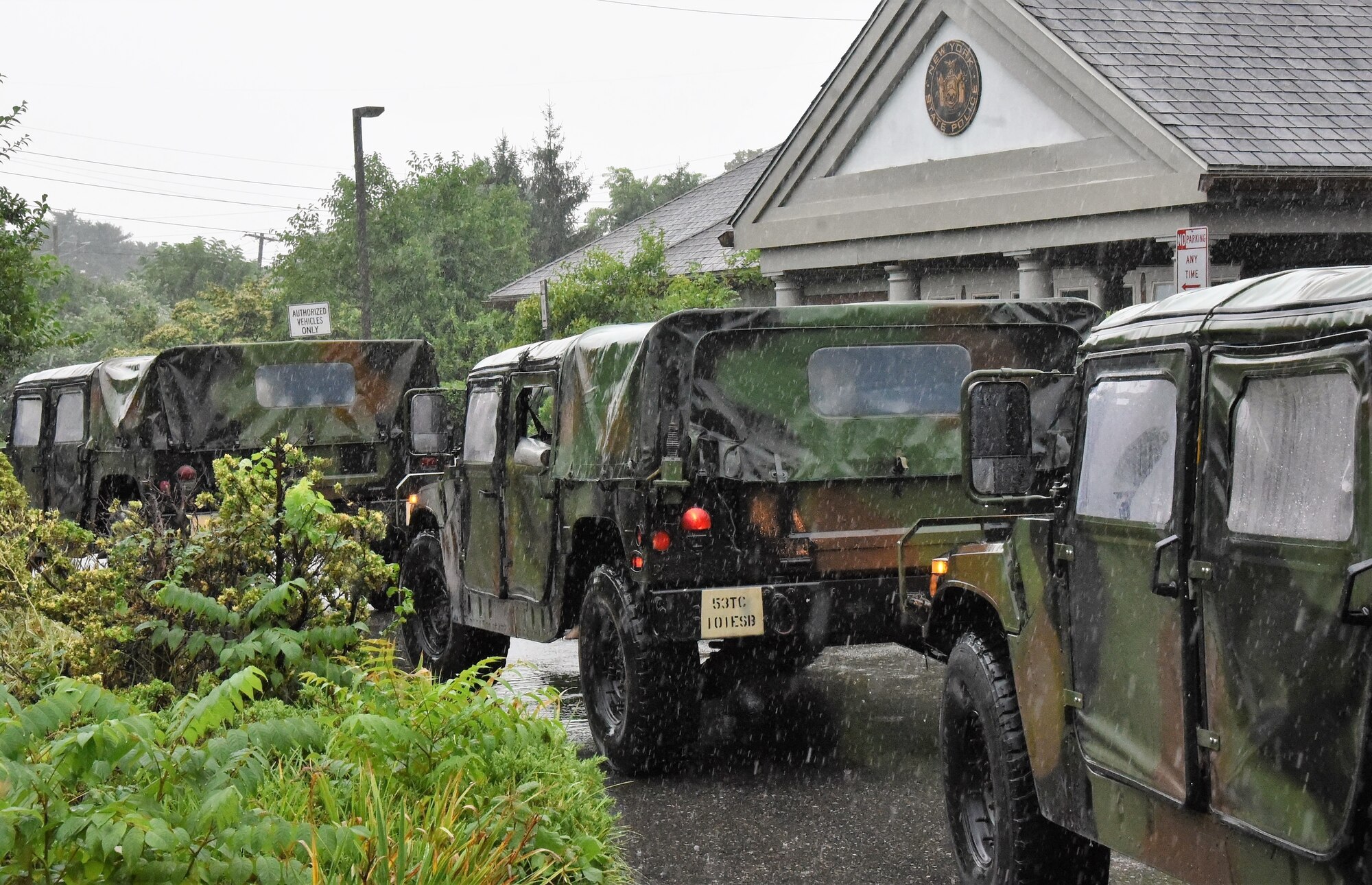 Humvees in front of the New York State Police Troop L in Brentwood, New York, Aug. 22, 2021, as part of the New York National Guard response to the anticipated landfall of Tropical Storm Henri. The Guard activated 500 Soldiers and Airmen on Long Island, New York City and in the Hudson Valley and Albany area to respond to any government requests for assistance.