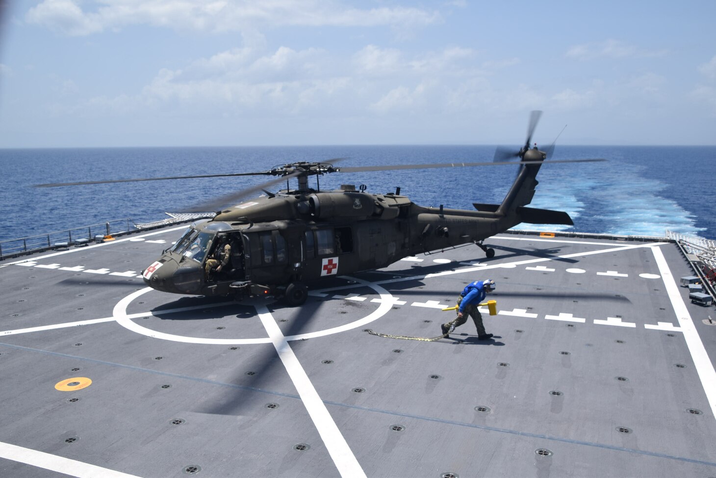 A U.S. Army UH-60 Blackhawk helicopter prepares to take off from the flight deck of the Spearhead-class expeditionary fast transport ship USNS Burlington (T-EPF 10) after refueling, Aug. 21, 2021.