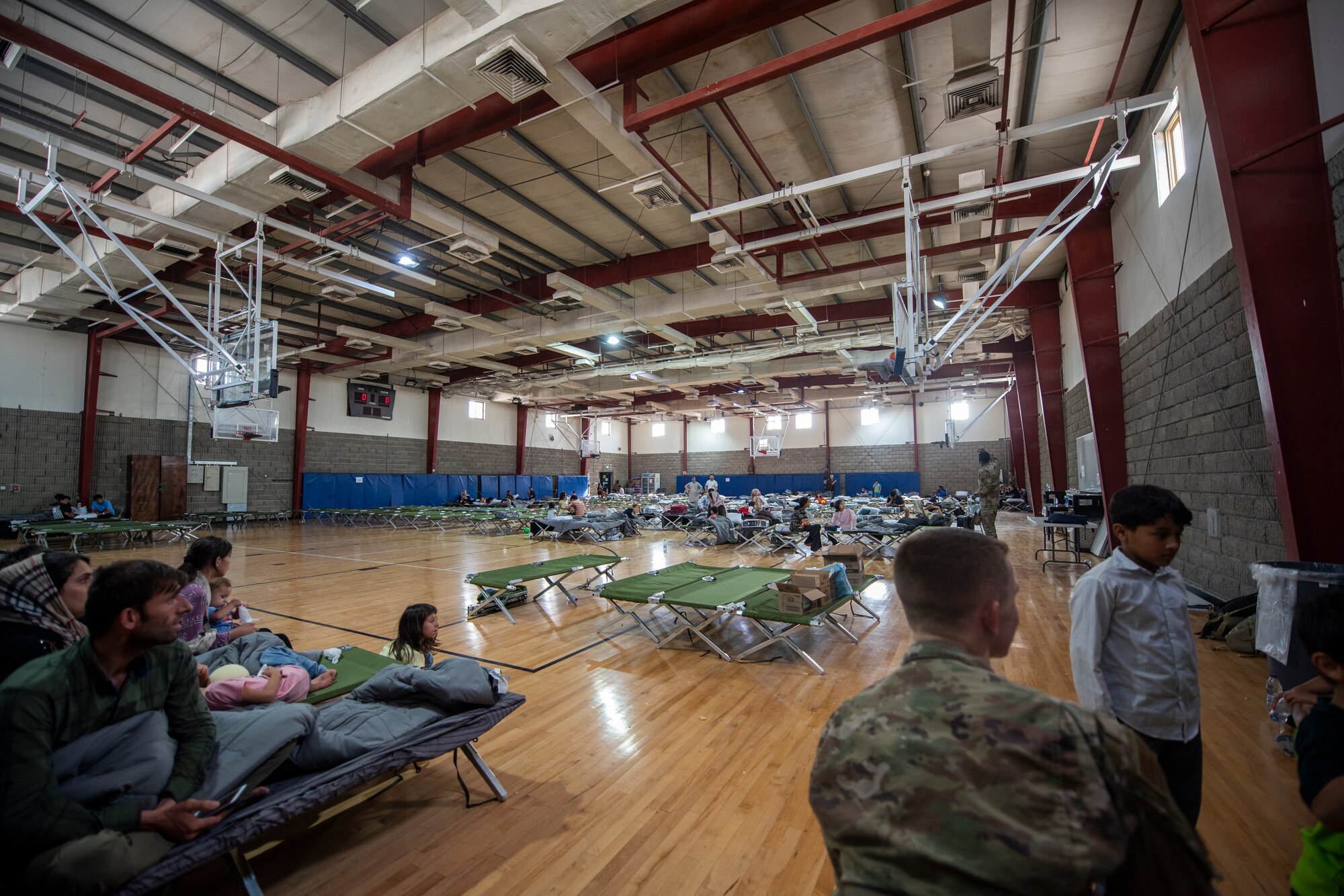 Qualified evacuees rest at a gym in the CENTCOM region, Aug. 20, 2021.