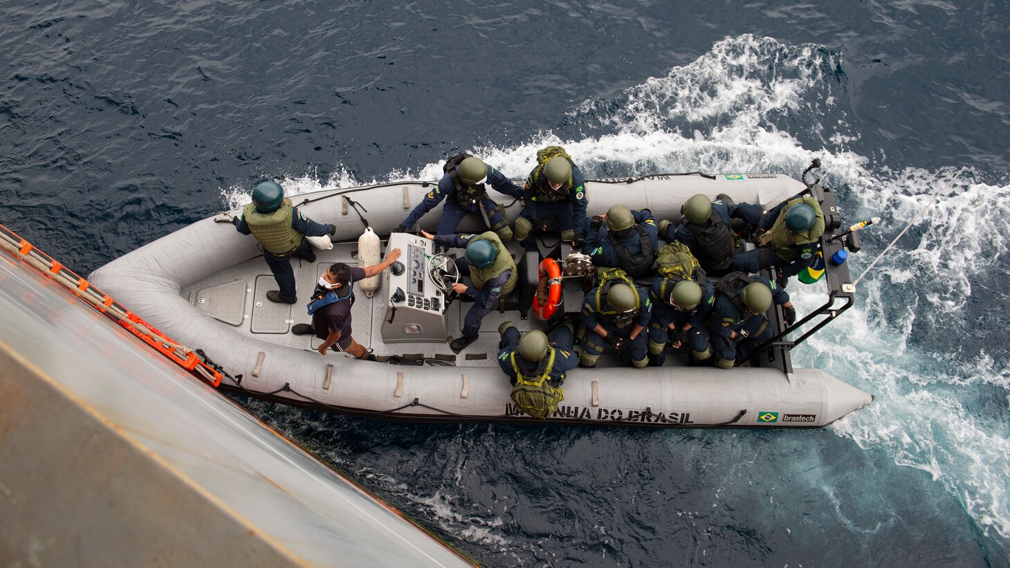 Members of a Brazilian Navy visit, board, search, and seizure (VBSS) team return to their boat following a drill aboard the Expeditionary Sea Base USS Hershel "Woody" Williams (ESB 4), Aug. 22, 2021. Hershel "Woody" Williams is conducting a maritime security capability exercise to build on its existing partnership with the Brazilian Navy and joint interoperability operations with allies and partners during a scheduled deployment in the U.S. Sixth Fleet area of operations in support of U.S. national interests and security in Europe and Africa.