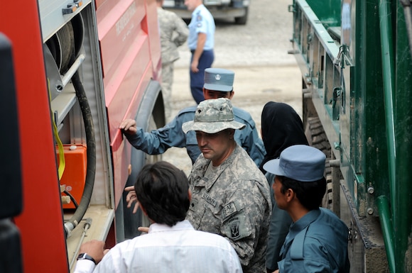 U.S. Army Spc. Travis Hale, a combat engineer with Headquarters and Headquarters Company, 86th Infantry Brigade Combat Team (Mountain), Task Force Wolverine, inspects Afghan National Police's firefighting equipment at the Operations Command Center Aug. 5, 2010 in Bamyan, Afghanistan.