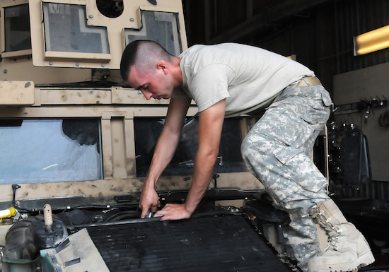 Sgt. Nathian Foster, a vehicle mechanic for Bravo Company, 186th Brigade Support Battalion, Vermont Army National Guard, works on a Humvee Aug. 10, 2010, in the maintenance shop at Camp Phoenix in Kabul, Afghanistan. Members of Bravo Company have done more than 2,000 jobs in the course of five months supporting all camps in the Kabul Base Cluster.