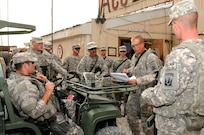 Staff Sgt. Peter Rawling, center, convoy commander for Alpha Company, 186th Brigade Support Battalion, Vermont Army National Guard, provides a convoy brief Aug. 10, 2010, at Camp Phoenix in Kabul, Afghanistan, before the movement team heads out on a mission to deliver personnel and supplies. Alpha Company's truck platoon has moved more than 14,000 passengers in the first five months of their deployment.