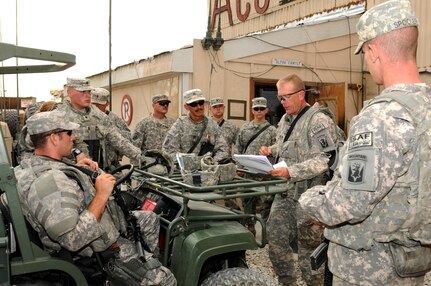 Staff Sgt. Peter Rawling, center, convoy commander for Alpha Company, 186th Brigade Support Battalion, Vermont Army National Guard, provides a convoy brief Aug. 10, 2010, at Camp Phoenix in Kabul, Afghanistan, before the movement team heads out on a mission to deliver personnel and supplies. Alpha Company's truck platoon has moved more than 14,000 passengers in the first five months of their deployment.