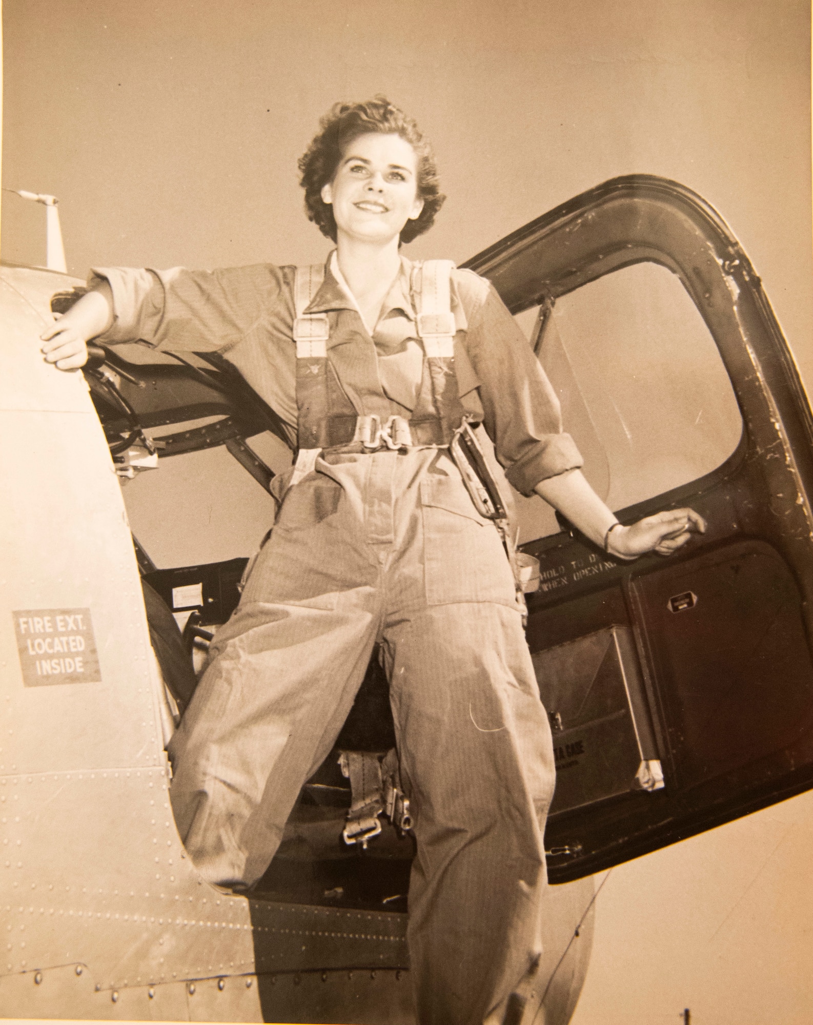 A photo of Lorraine Vogelsang, a Women’s Army Corps veteran, climbing out of an aircraft during her time in the service sits on display at her Cincinnati, Ohio, home, Aug. 19, 2021. Vogelsang served in the WAC from February 1943 until August 1945. (U.S. Air Force photo by Wesley Farnsworth)