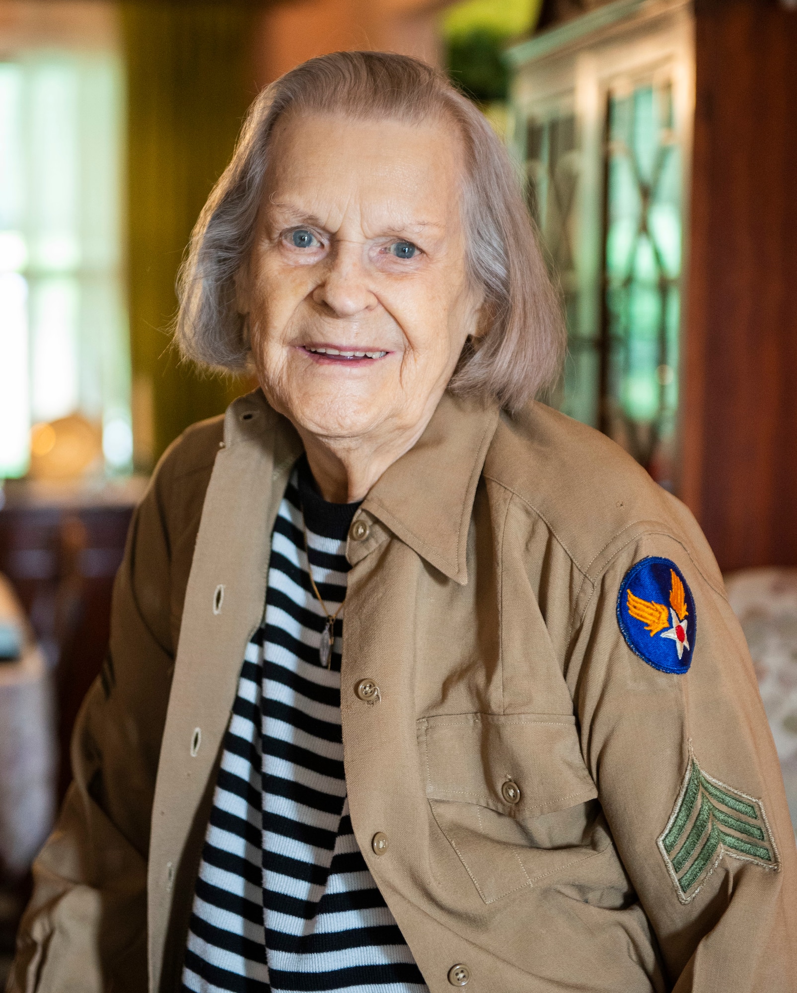 Lorraine Vogelsang, a Womens Army Corps veteran, poses for a photo wearing her uniform top from her time in the service inside her Cincinnati, Ohio, home, Aug. 19, 2021. Vogelsang served in the WAC from February 1943 until August 1945. (U.S. Air Force photo by Wesley Farnsworth)