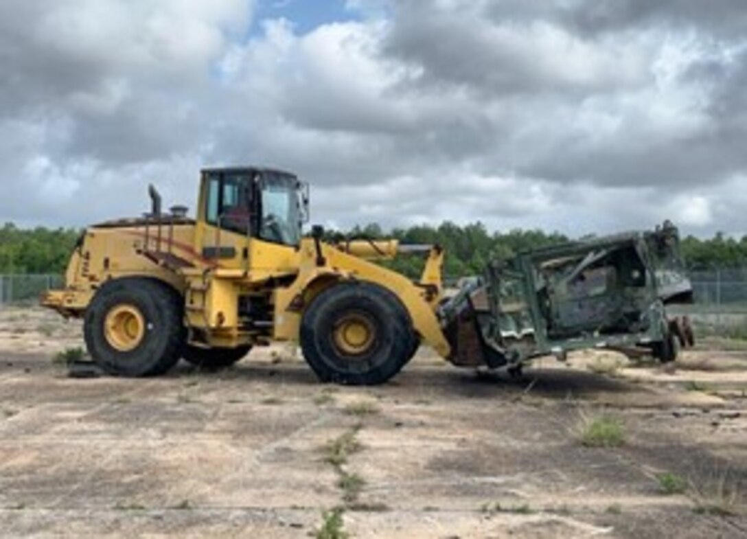 Fork lift with a load of scrap.