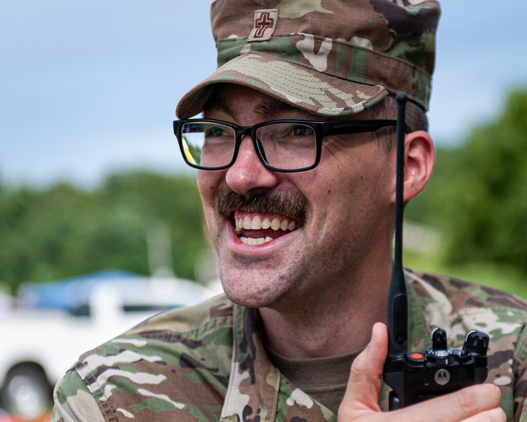 U.S. Air Force Chaplain (1st Lt.) Philip Nelson, a staff chaplain for the 181st Intelligence Wing, smiles while talking on a radio at Muscatatuck Urban Training Center, Ind., Aug. 14, 2021. Airmen from the 181st Chaplain’s Office supported exercise Homeland Defender, which is a joint domestic response exercise involving more than a dozen military and civilian emergency management agencies. (U.S. Air National Guard photo by 2nd Lt. Jonathan W. Padish)