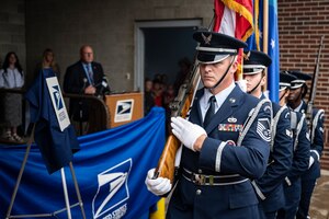 Members of the 911th Airlift Wing Honor Guard prepare to present the colors during a dedication ceremony renaming the post office in Hookstown, Pennsylvania, Aug. 16, 2021. The post office was renamed after a fallen Airman, Staff Sgt. Dylan Elchin, who was killed by a roadside bomb in Afghanistan’s Ghazni province in November 2018.