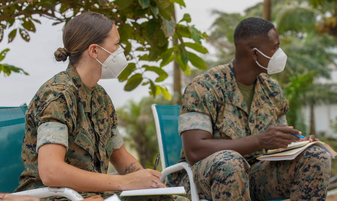 U.S. Marine Corps Staff Sgt. Brytani Musick, Communication Strategy and Operations Production Chief, and Staff Sgt. Isaac Pelendo, African Foreign Area Staff Non-Commissioned Officer, with Marine Corps Forces Europe and Africa (MARFOREUR/AF), discuss the upcoming Women, Peace, and Security (WPS) engagement in Monrovia, Liberia, July 29, 2021. U.S. Marines from MARFOREUR/AF travelled to West Africa to conduct an event in support of the WPS program as part of a national effort to promote the meaningful contributions of women in defense and security sectors around the world. WPS focuses on improving effectiveness of foreign policy and efforts by proactively integrating the needs and perspectives of women, while also empowering them to contribute their talents and energies to international peace, security, and prosperity. (U.S. Marine Corps photo by Sgt. James Bourgeois/Released)