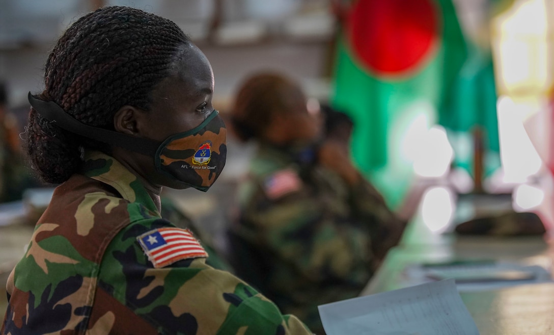 A member of the Armed Forces of Liberia (AFL) engages in discussions during the Women, Peace, and Security (WPS) engagement in Monrovia, Liberia, July 30, 2021. Marines from MARFOREUR/AF and U.S. Embassy representatives met with 15 AFL women during this first ever WPS engagement between the U.S. military and Liberian military. WPS is as an integral component in the effort to enhance African partner capability, enabling U.S. security cooperation to better leverage the contributions of both men and women. (U.S. Marine Corps photo by Sgt. James Bourgeois)