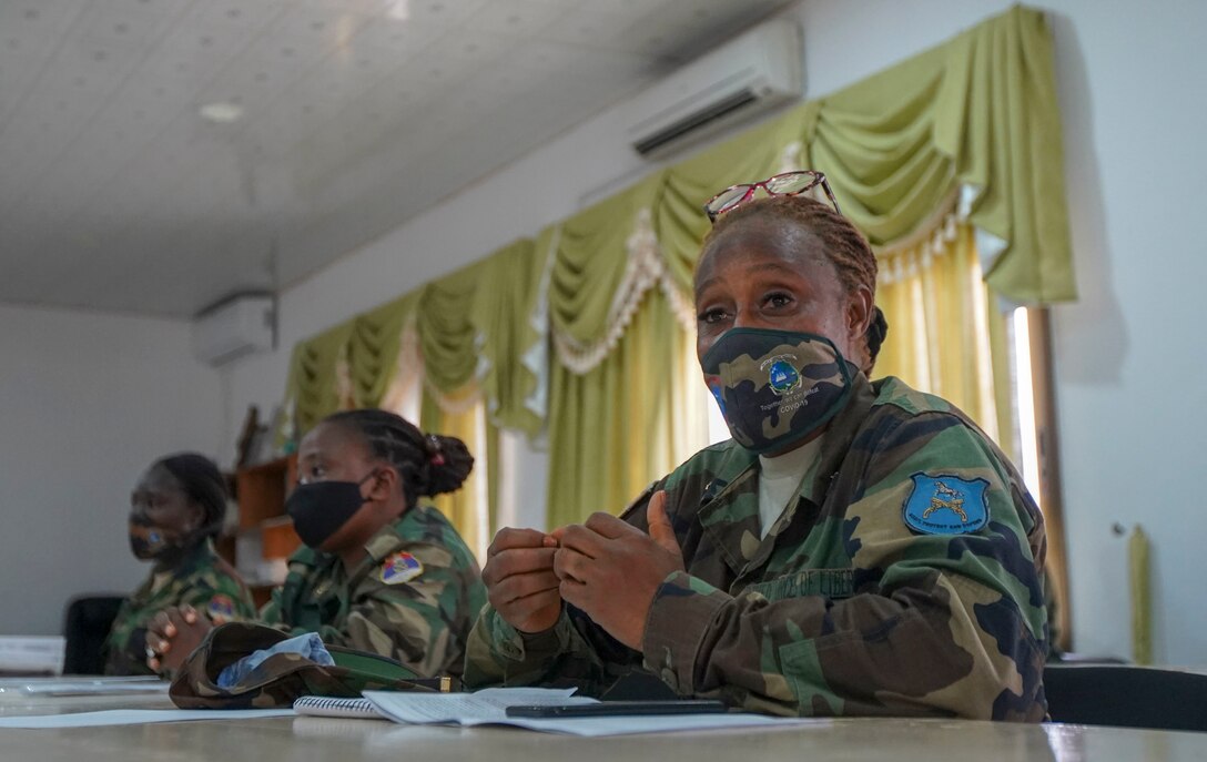 A member of the Armed Forces of Liberia (AFL) engages in discussion during the Women, Peace, and Security (WPS) engagement in Monrovia, Liberia, July 30, 2021. Marines from MARFOREUR/AF and U.S. Embassy representatives met with 15 AFL women during this first ever WPS engagement between the U.S. military and Liberian military. WPS is as an integral component in the effort to enhance African partner capability, enabling U.S. security cooperation to better leverage the contributions of both men and women. (U.S. Marine Corps photo by Sgt. James Bourgeois)