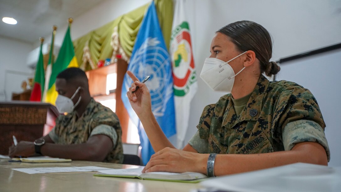 U.S. Marine Corps Staff Sgt. Brytani Musick, Communication Strategy and Operations Production Chief, with Marine Corps Forces Europe and Africa (MARFOREUR/AF), selects the next speaker during the Women, Peace, and Security (WPS) engagement in Monrovia, Liberia, July 30, 2021. Marines from MARFOREUR/AF and U.S. Embassy representatives met with 15 Armed Forces Liberia women during this first ever WPS engagement between the U.S. military and Liberian military. WPS is as an integral component in the effort to enhance African partner capability, enabling U.S. security cooperation to better leverage the contributions of both men and women. (U.S. Marine Corps photo by Sgt. James Bourgeois)