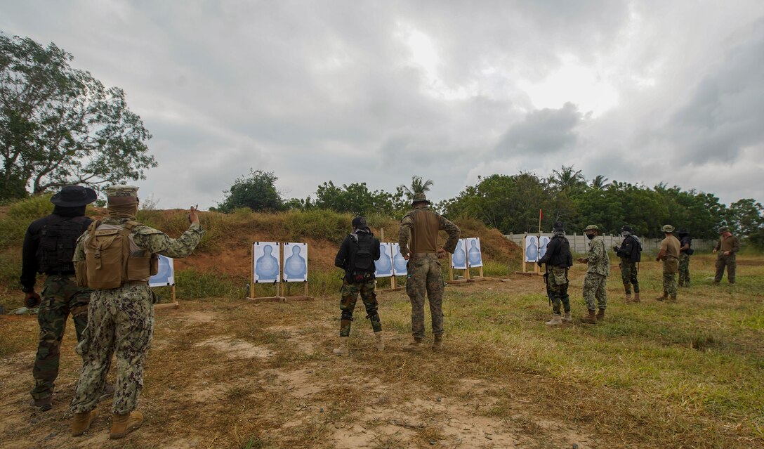 U.S. Marines and U.S. Sailors from Combined Task Force-68 instruct members of the Ghanaian Special Boat Squadron (SBS) during a live-fire drill at the Naval Training Command (NAVTRAC) in Nutekpor-Sogakope, Ghana, Aug. 12, 2021. Combined Task Force-68, deployed aboard the USS Hershel “Woody” Williams, conducted Theatre Security Cooperation training with the SBS at NAVTRAC to enhance operational capabilities and readiness throughout Western Africa. (U.S. Marine Corps photo by Sgt. James Bourgeois)