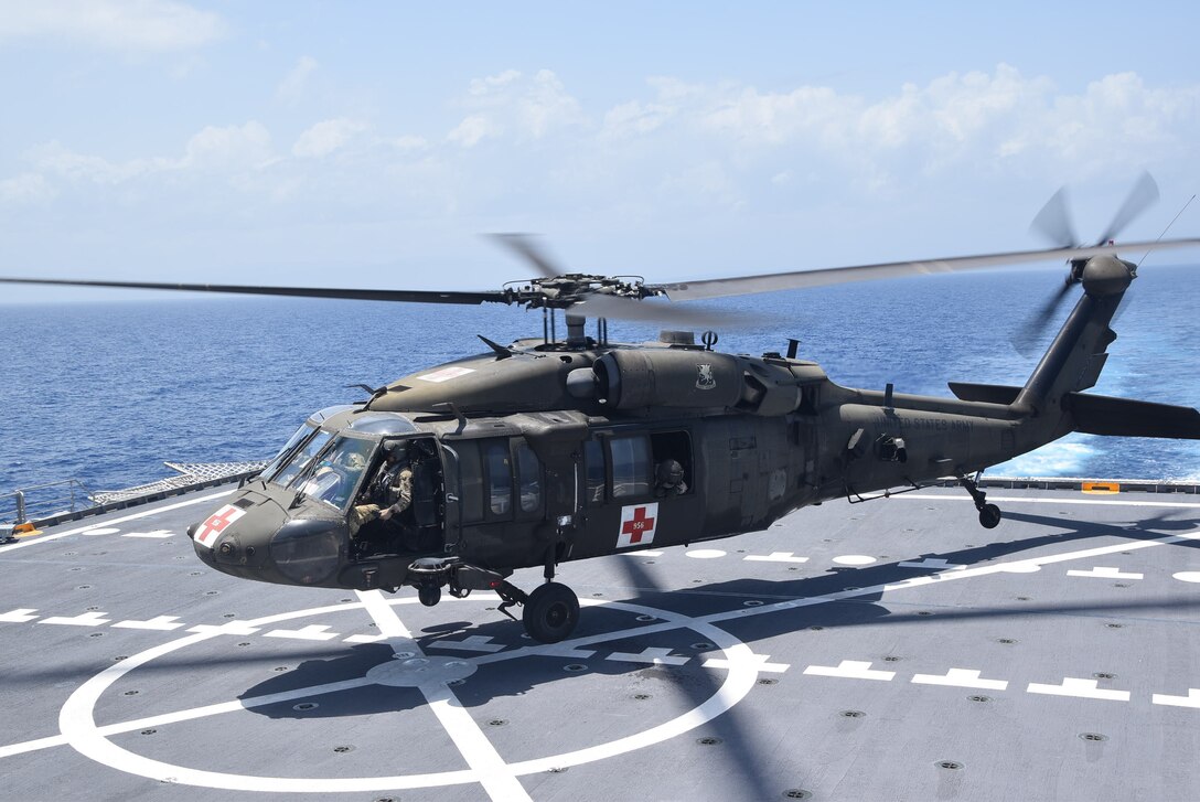 A U.S. Army UH-60 Blackhawk helicopter lands on the Spearhead-class expeditionary fast transport ship USNS Burlington (T-EPF 10) to refuel, Aug. 21, 2021.