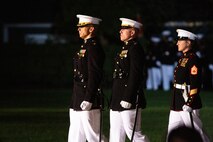 Marines with the parade staff march down Center Walk during the Friday Evening Parade at Marine Barracks Washington, Aug. 20, 2021.
