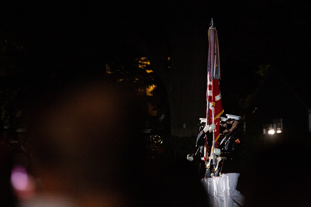 Marines with the Official U.S. Marine Corps Color Guard present the National Ensign during the Friday Evening Parade at Marine Barracks Washington, Aug. 20, 2021. The guest of honor for the evening was Mr. Robert J. Conte III, Chief of the Metropolitan Police Department, and the hosting official was Lt. Gen. David A. Ottignon, Deputy Commandant for Manpower and Reserve. (U.S. Marine Corps photo by Lance Cpl. Tanner D. Lambert)