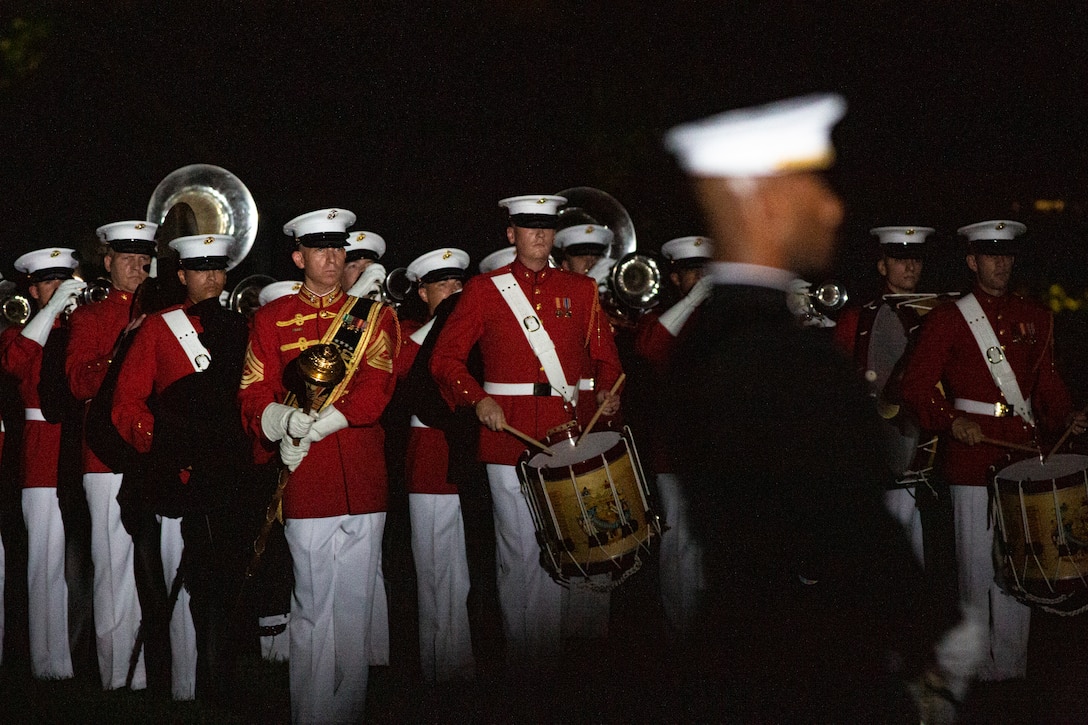 Master Sgt. Joshua Dannemiller, assistant drum major, “The Commandant’s Own,” U.S. Marine Drum and Bugle Corps, conducts “slow march” during the Friday Evening Parade at Marine Barracks Washington, Aug. 20, 2021. The guest of honor for the evening was Mr. Robert J. Conte III, Chief of the Metropolitan Police Department, and the hosting official was Lt. Gen. David A. Ottignon, Deputy Commandant for Manpower and Reserve. (U.S. Marine Corps photo by Lance Cpl. Tanner D. Lambert)