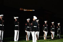 Marines with the Silent Drill Platoon execute their “rifle inspection” sequence during the Friday Evening Parade at Marine Barracks Washington, Aug. 20, 2021.