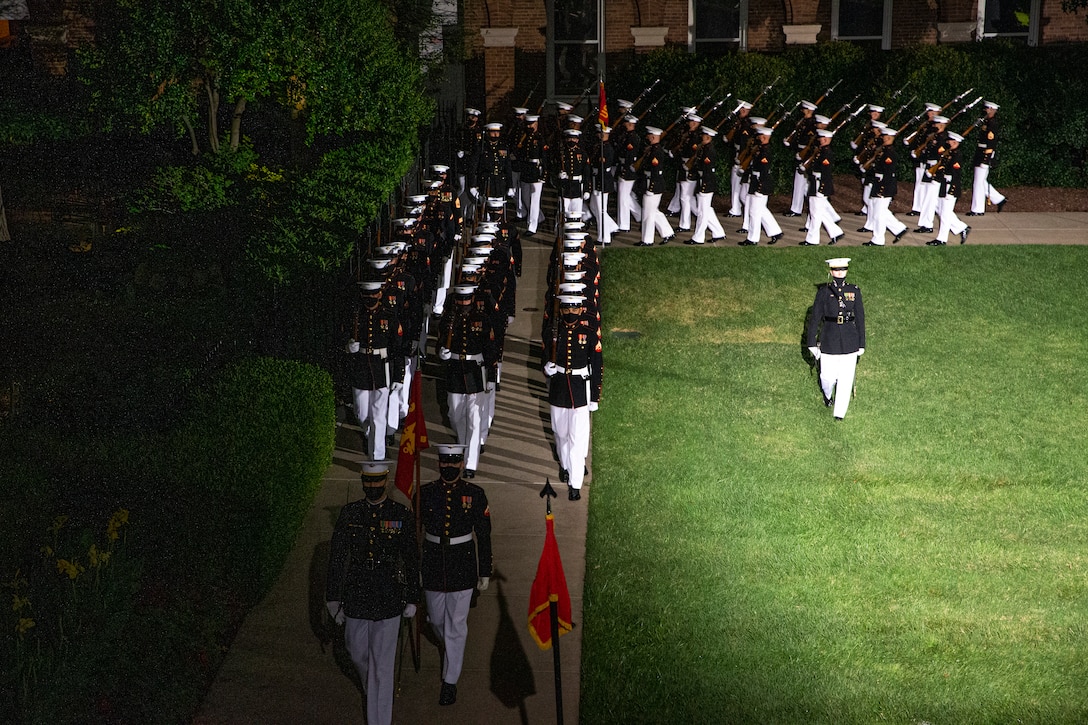 Marines with Marine Barracks Washington conduct “pass in review” during the Friday Evening Parade at MBW, Aug. 20, 2021. The guest of honor for the evening was Mr. Robert J. Conte III, Chief of the Metropolitan Police Department, and the hosting official was Lt. Gen. David A. Ottignon, Deputy Commandant for Manpower and Reserve. (U.S. Marine Corps photo by Lance Cpl. Tanner D. Lambert)