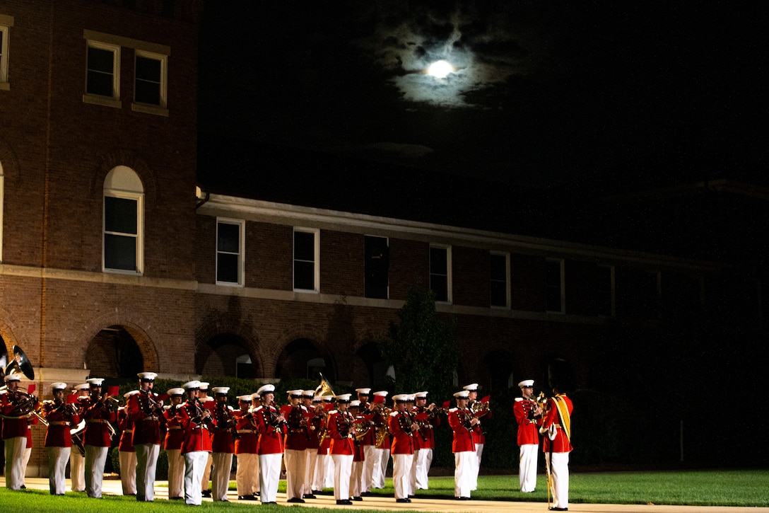 Marines with “The President’s Own,” U.S. Marine Band, perform during the Friday Evening Parade at Marine Barracks Washington, Aug. 20, 2021. The guest of honor for the evening was Mr. Robert J. Conte III, Chief of the Metropolitan Police Department, and the hosting official was Lt. Gen. David A. Ottignon, Deputy Commandant for Manpower and Reserve. (U.S. Marine Corps photo by Lance Cpl. Allen T. Sanders)