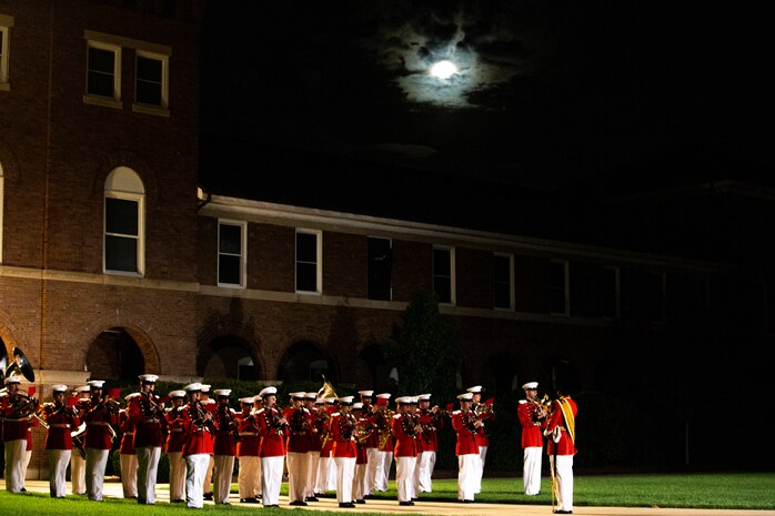 Marines with “The President’s Own,” U.S. Marine Band, perform during the Friday Evening Parade at Marine Barracks Washington, Aug. 20, 2021.