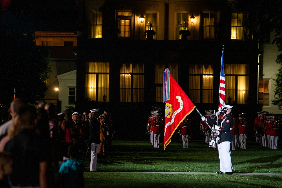 Marines with the Official U.S. Marine Corps Color Guard present the National Ensign during the Friday Evening Parade at Marine Barracks Washington, Aug. 20, 2021. The guest of honor for the evening was Mr. Robert J. Conte III, Chief of the Metropolitan Police Department, and the hosting official was Lt. Gen. David A. Ottignon, Deputy Commandant for Manpower and Reserve. (U.S. Marine Corps photo by Lance Cpl. Allen T. Sanders)