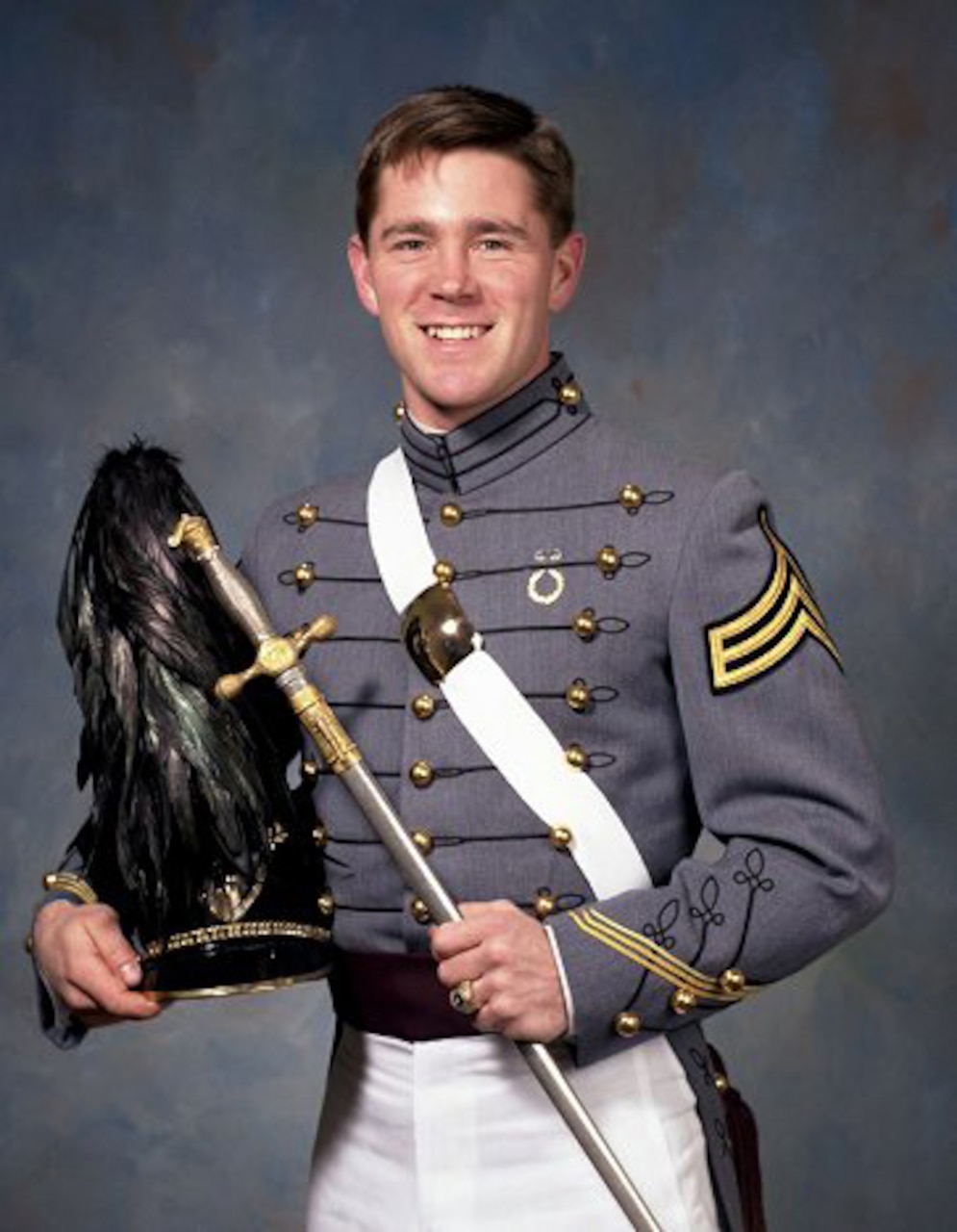 An Army cadet poses for a photo.